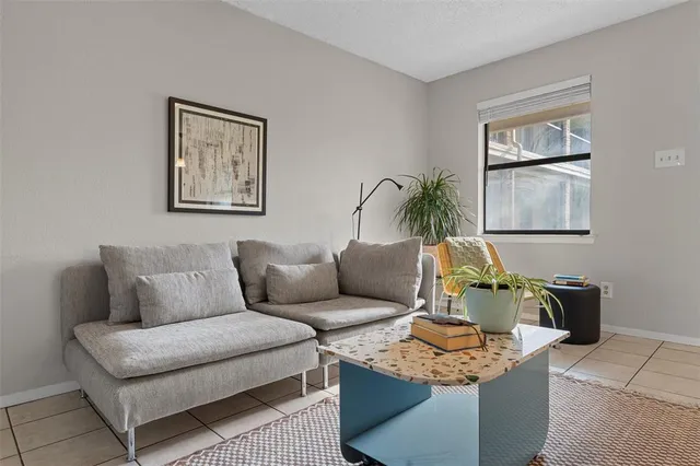a view of dining room with furniture and a potted plant