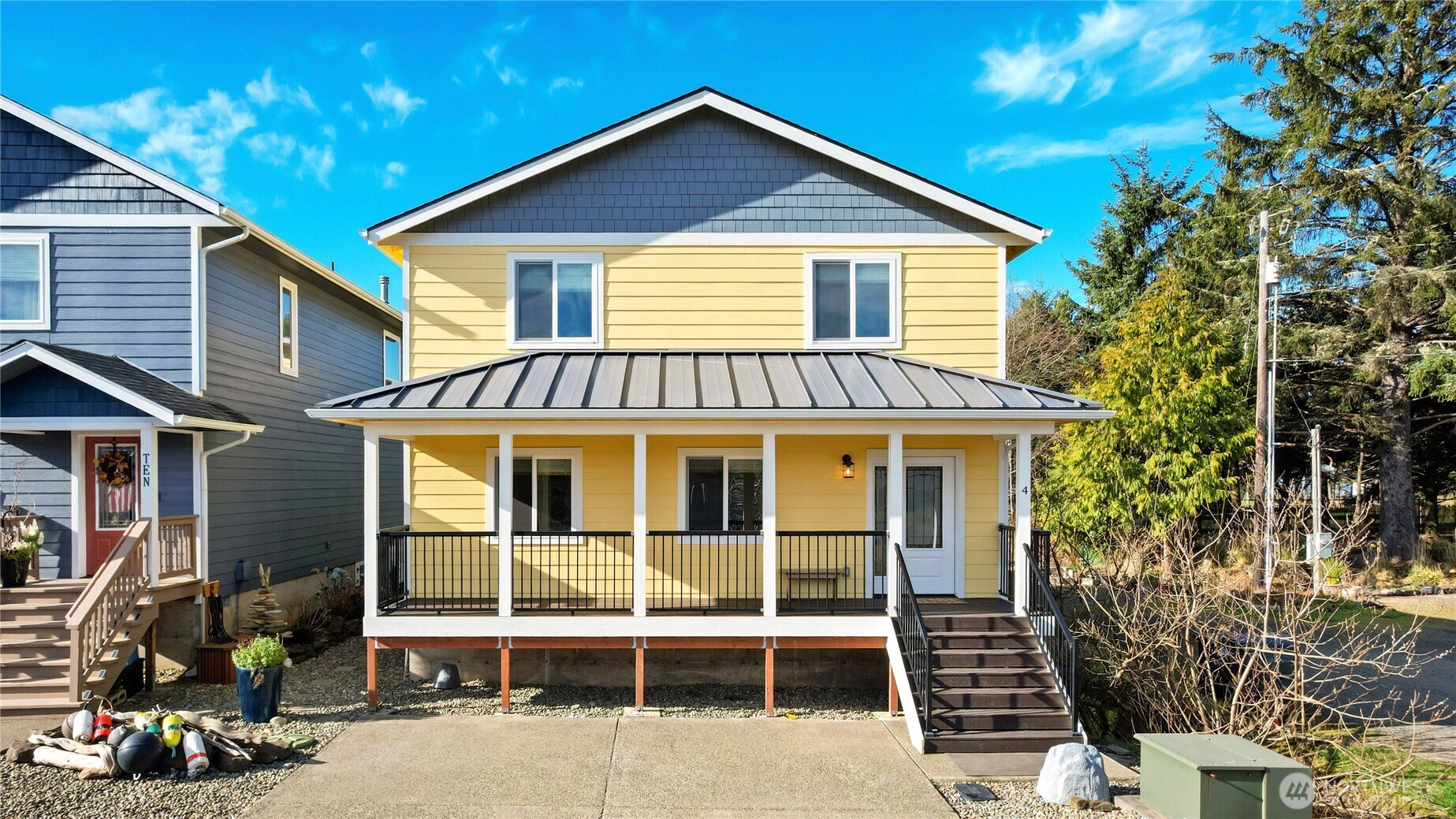 a view of a house with yard and sitting area