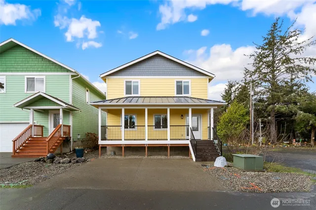 a view of a house with a patio and a garden
