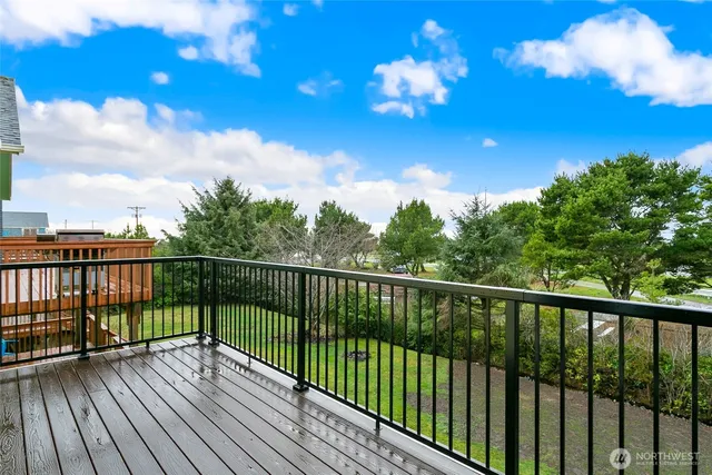 a view of balcony with wooden floor