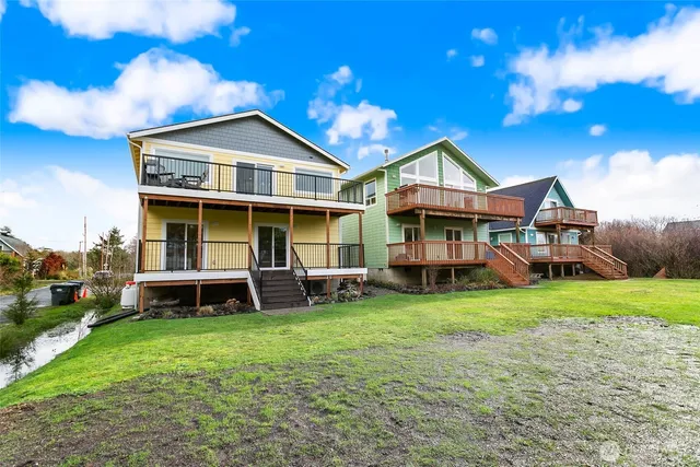 a view of a house with a yard porch and sitting area