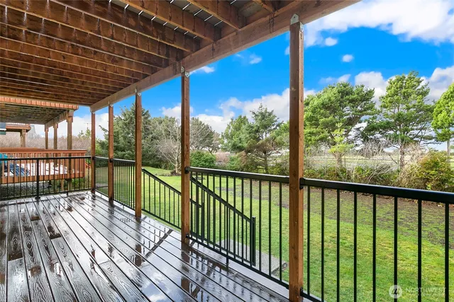 a view of balcony with wooden floor