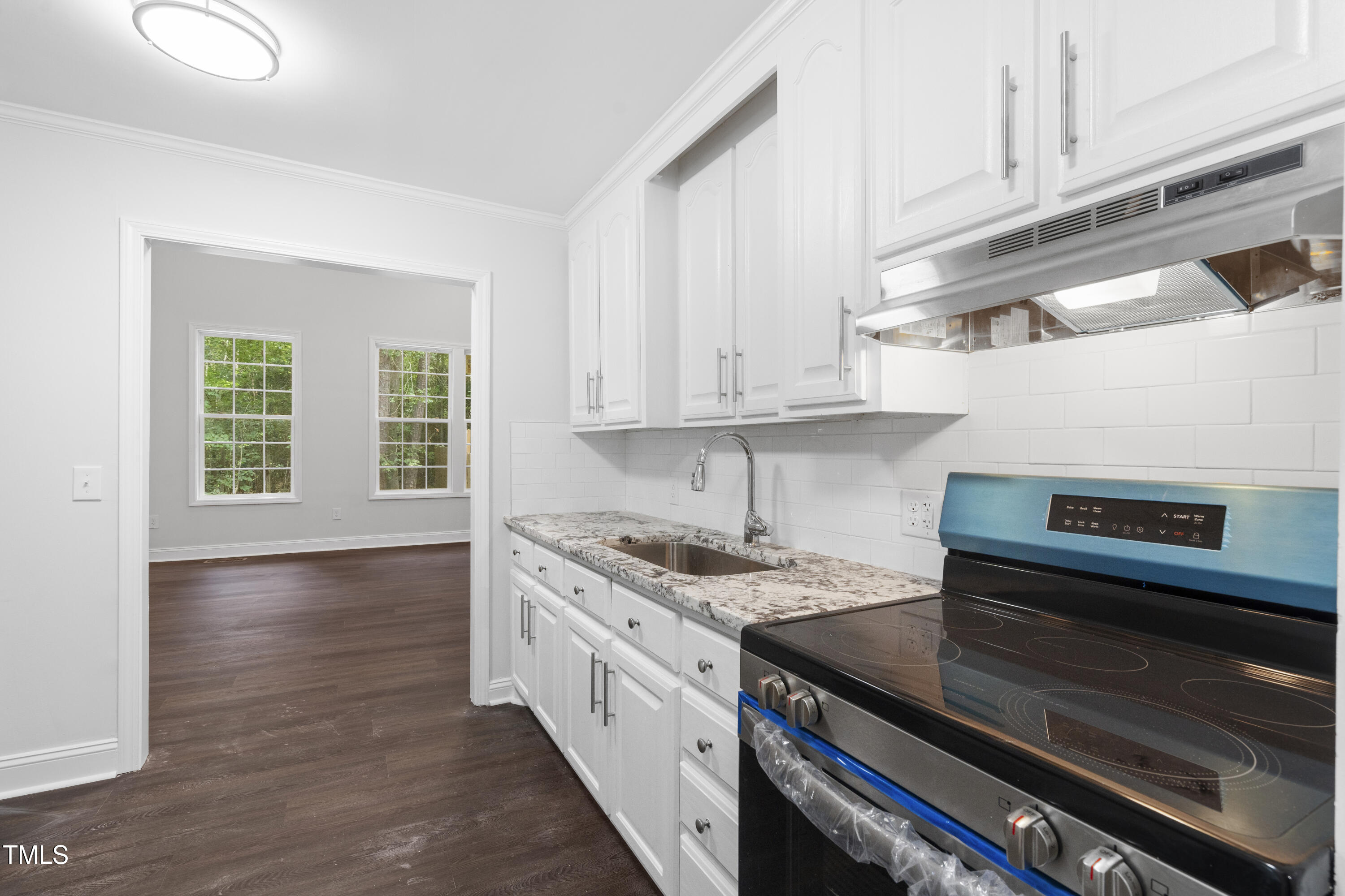 951 Walter Bright Road Sanford, NC 27330 - Photo 12 of 42 a kitchen with stainless steel appliances granite countertop a sink and a stove