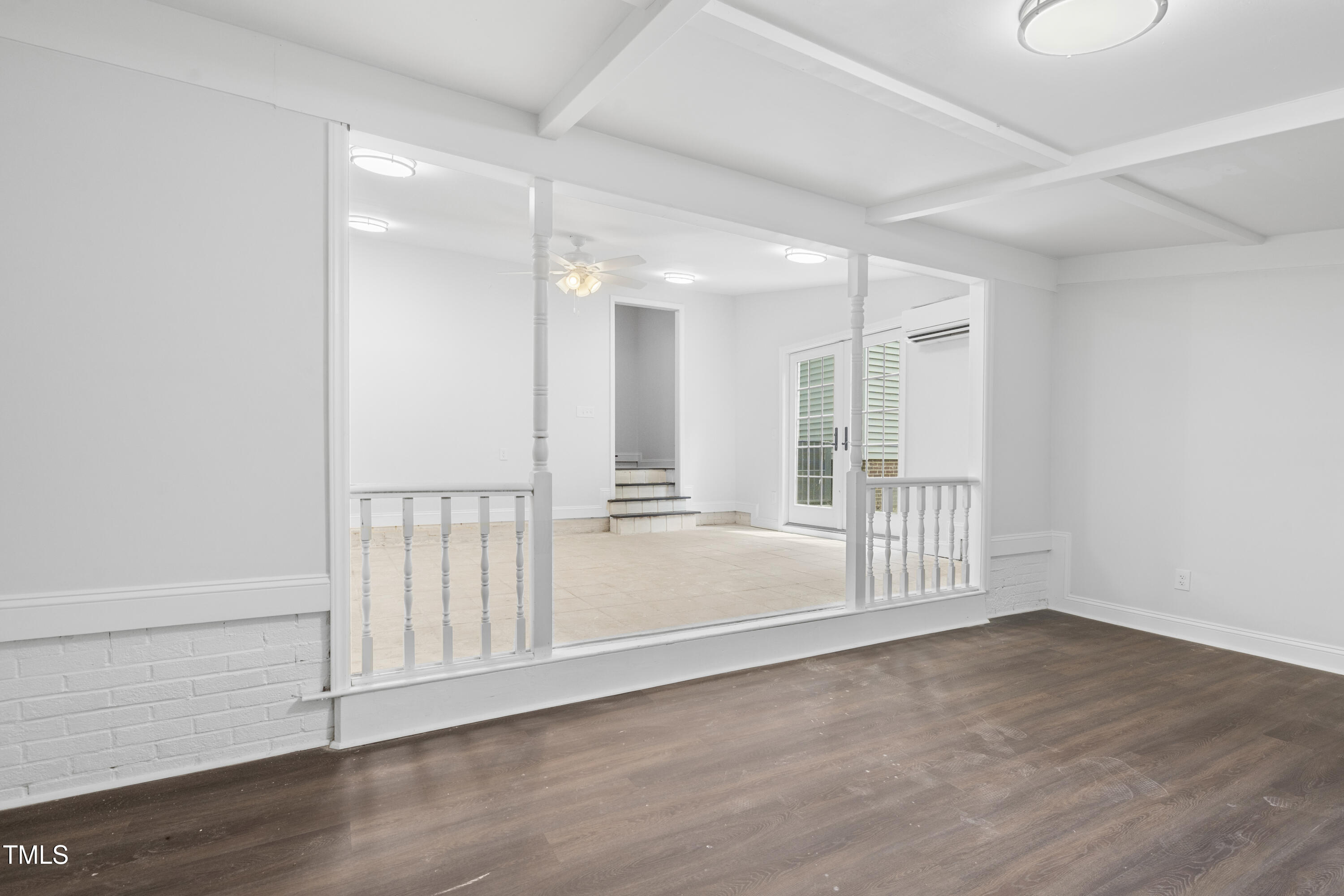 951 Walter Bright Road Sanford, NC 27330 - Photo 14 of 42 a view of an empty room with wooden floor and a window