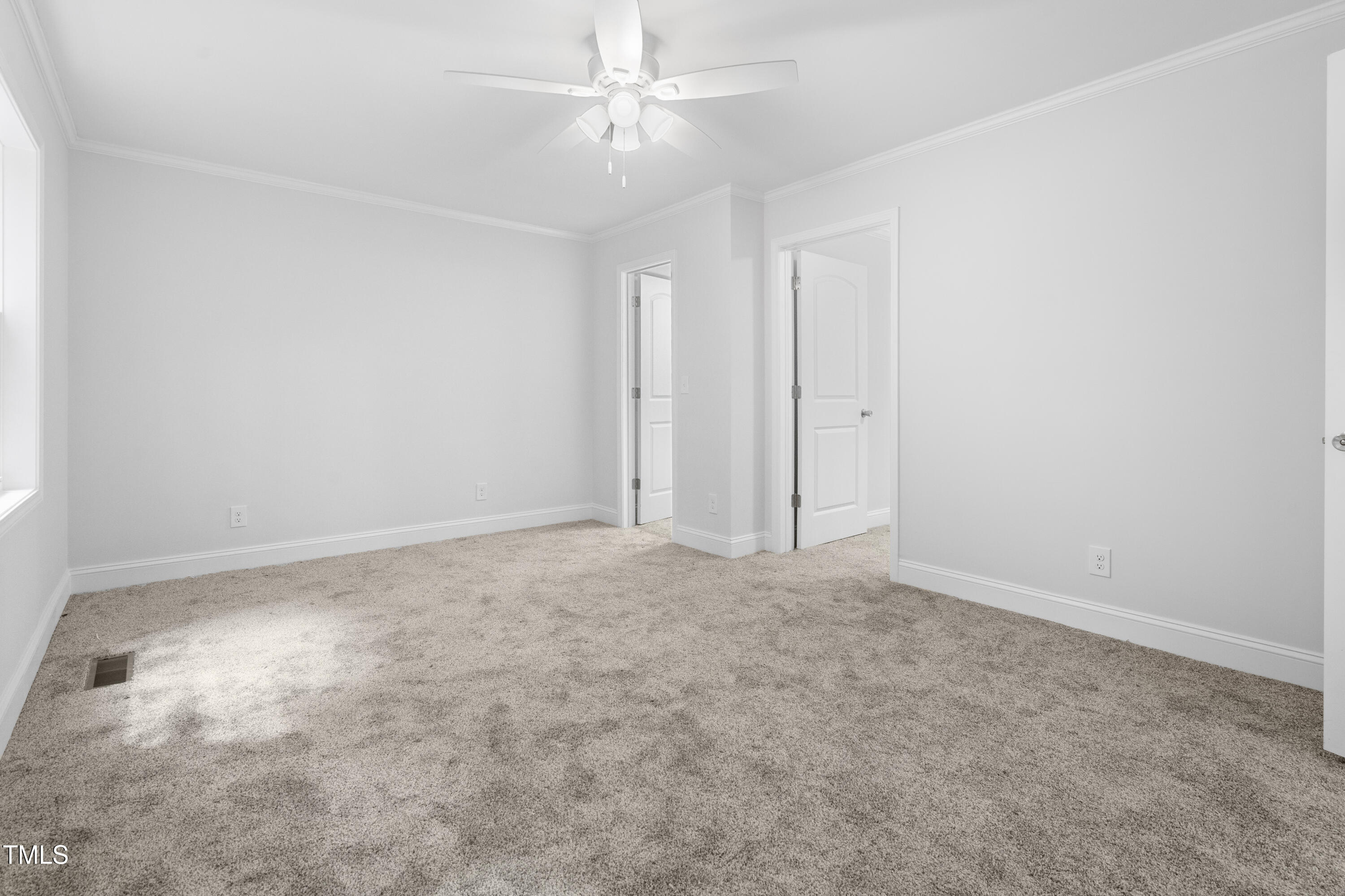 951 Walter Bright Road Sanford, NC 27330 - Photo 17 of 42 an empty room with a ceiling fan and a window