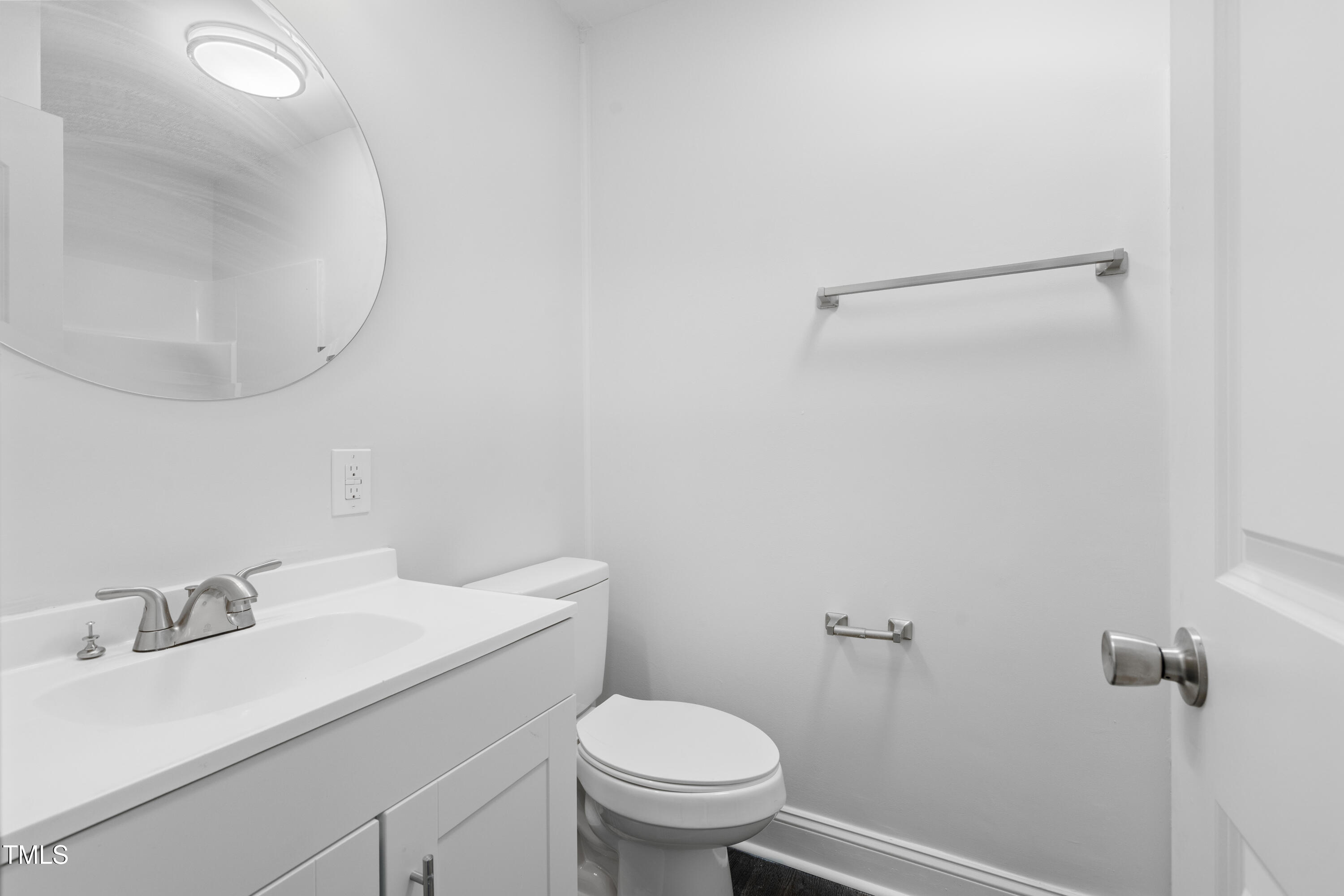 951 Walter Bright Road Sanford, NC 27330 - Photo 20 of 42 a bathroom with a sink a toilet and a mirror