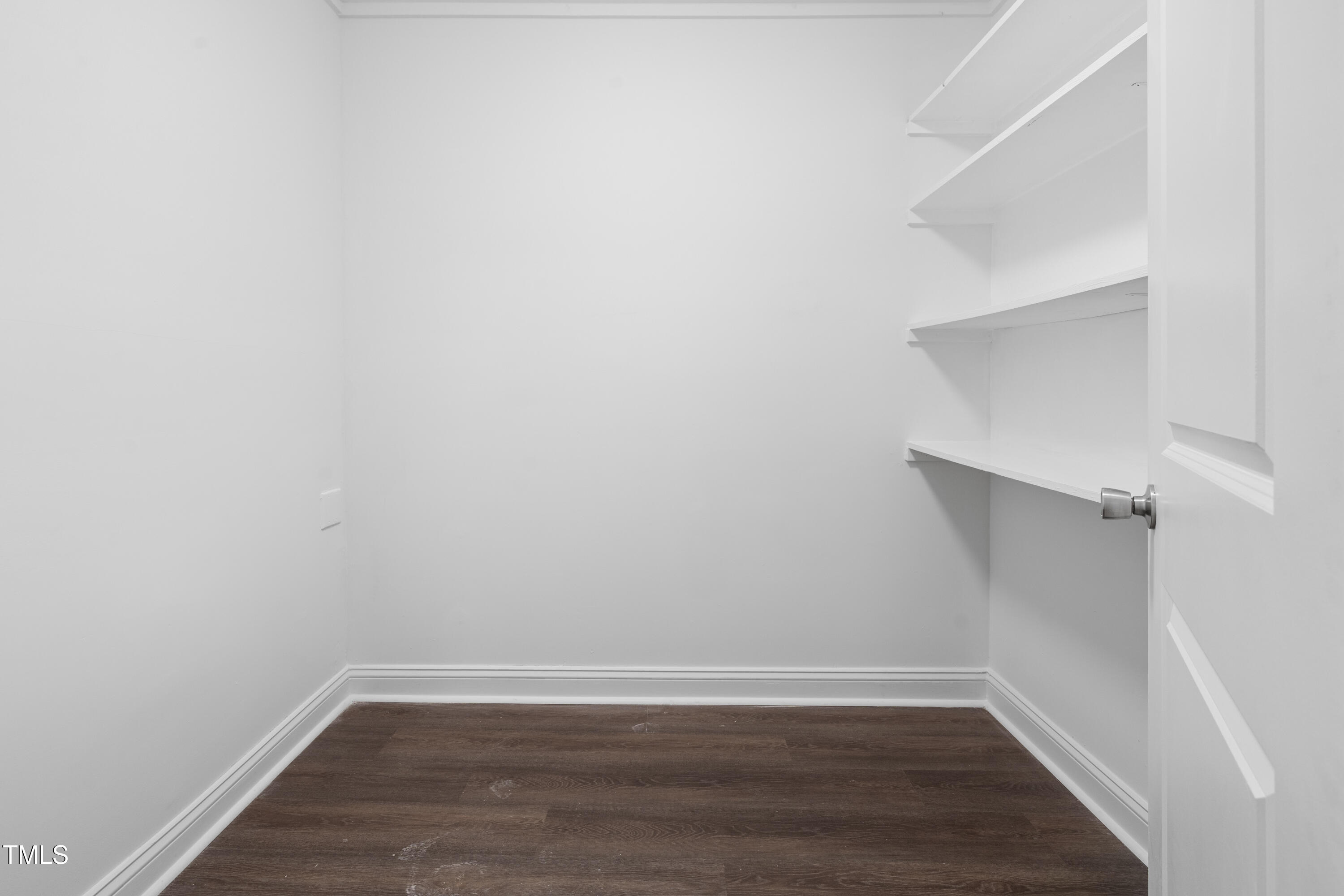 951 Walter Bright Road Sanford, NC 27330 - Photo 26 of 42 a view of an empty room with wooden floor