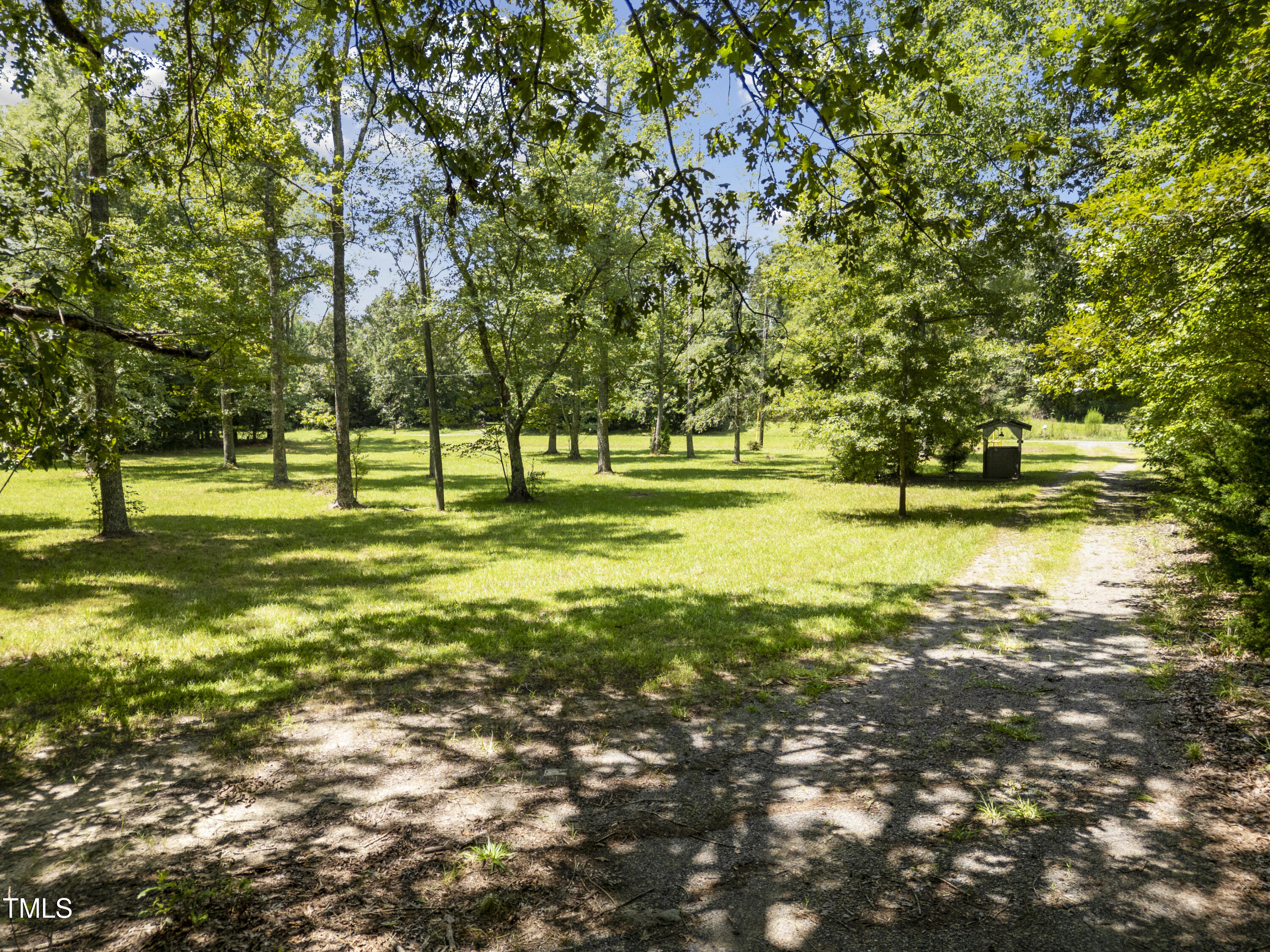 951 Walter Bright Road Sanford, NC 27330 - Photo 2 of 42 a view of swimming pool with a big yard and large trees