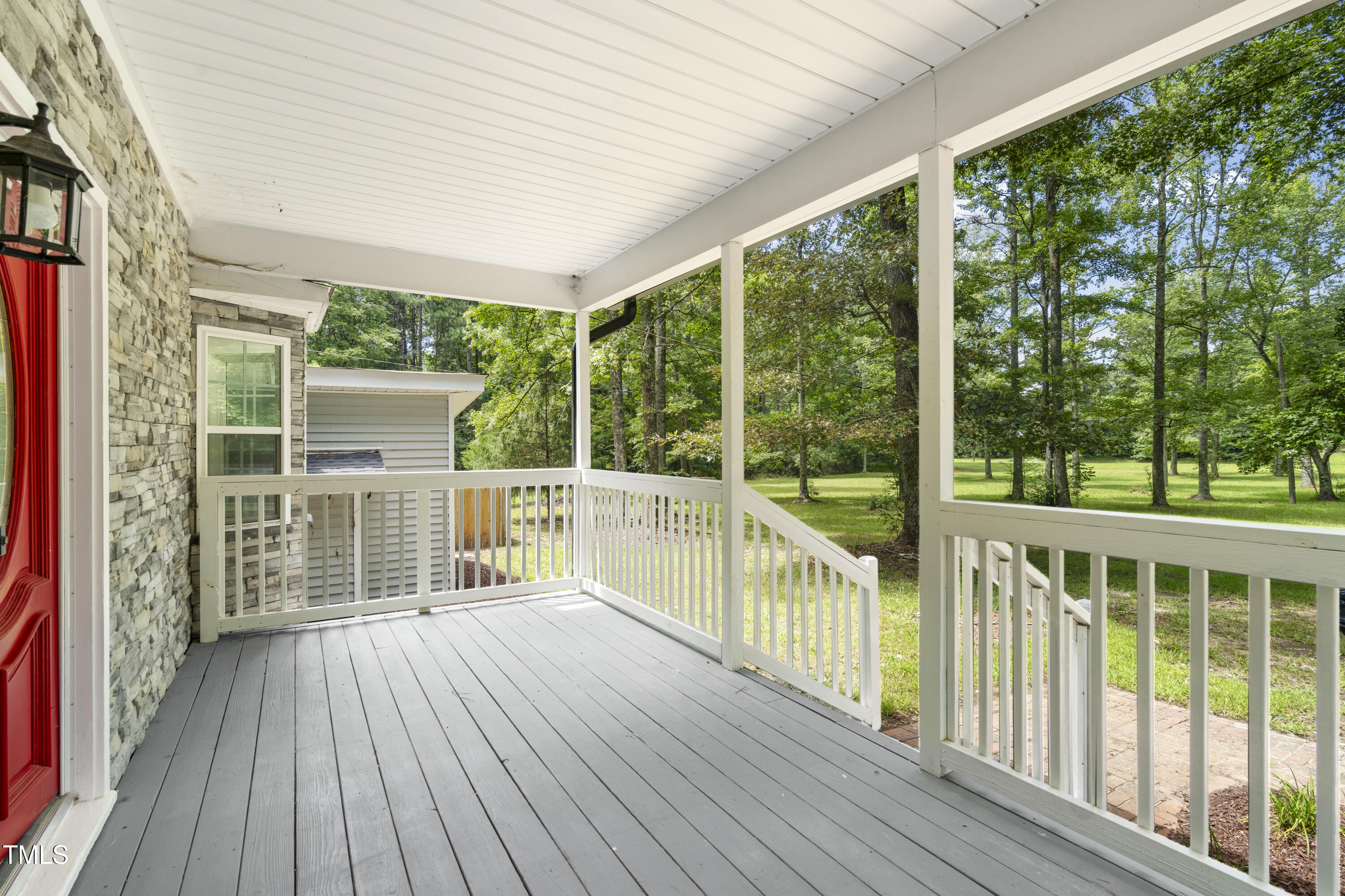 951 Walter Bright Road Sanford, NC 27330 - Photo 30 of 42 a balcony with wooden floor and outdoor space