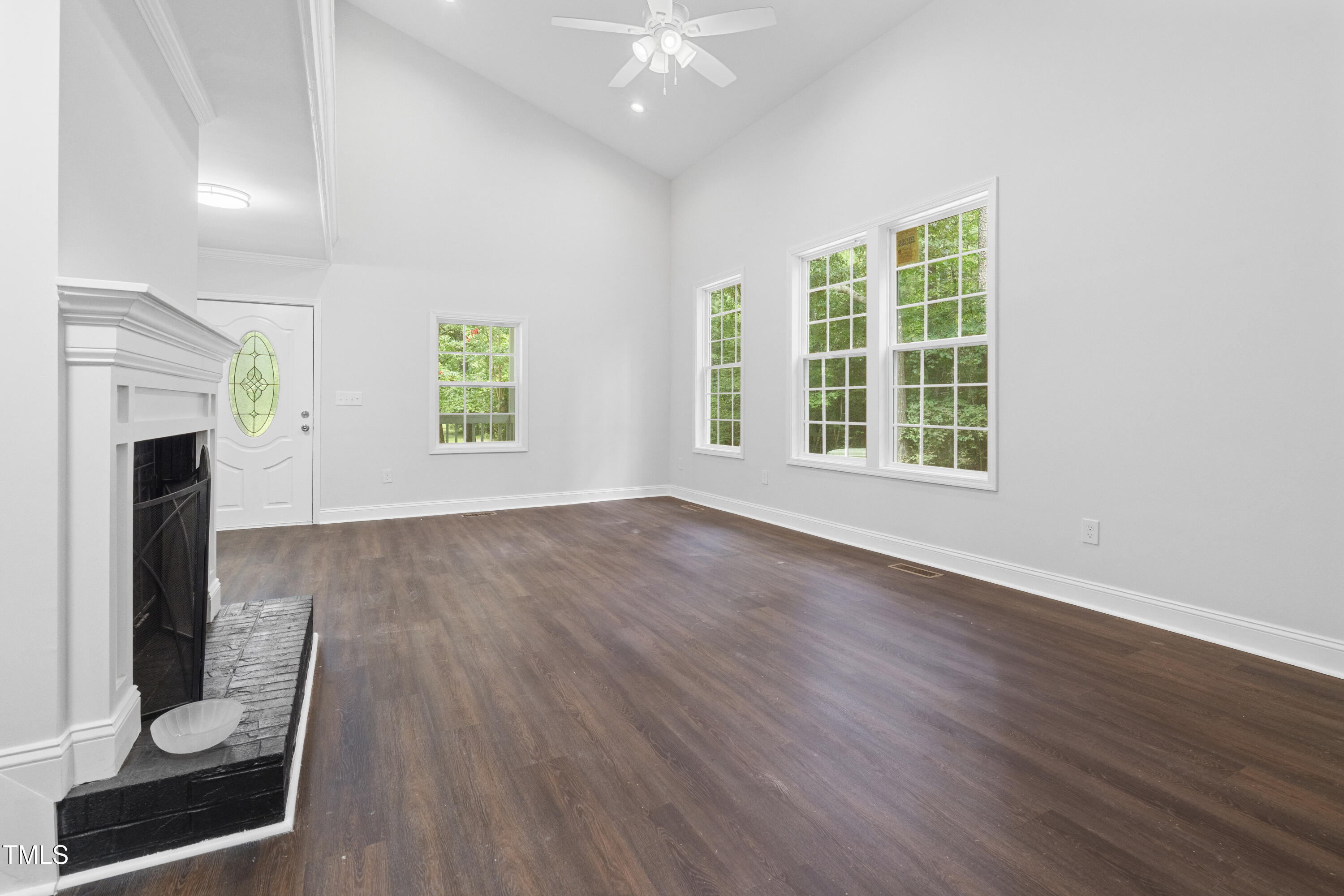 951 Walter Bright Road Sanford, NC 27330 - Photo 4 of 42 a view of an empty room with wooden floor and a window