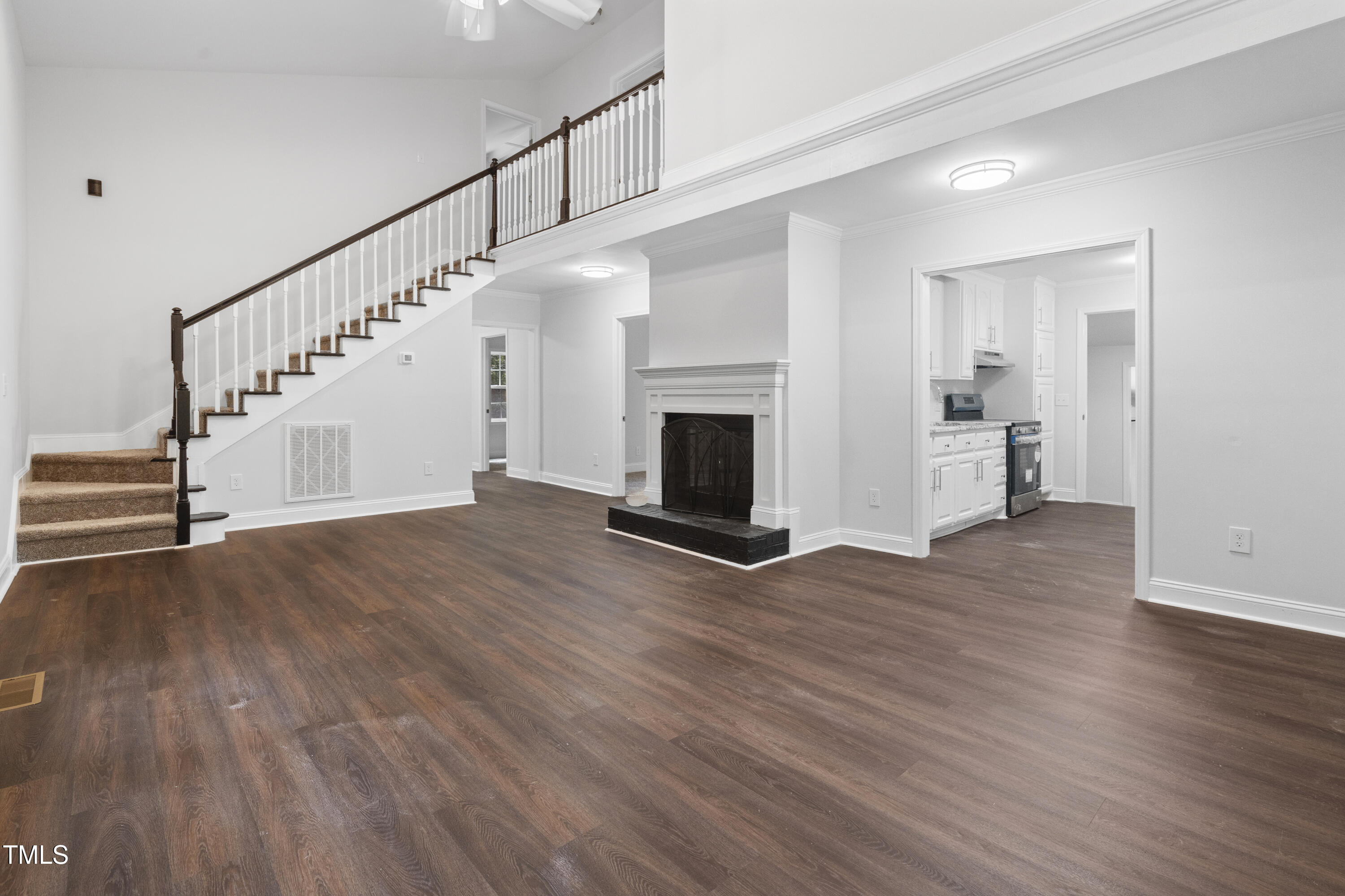 951 Walter Bright Road Sanford, NC 27330 - Photo 5 of 42 a view of empty room with wooden floor and fireplace