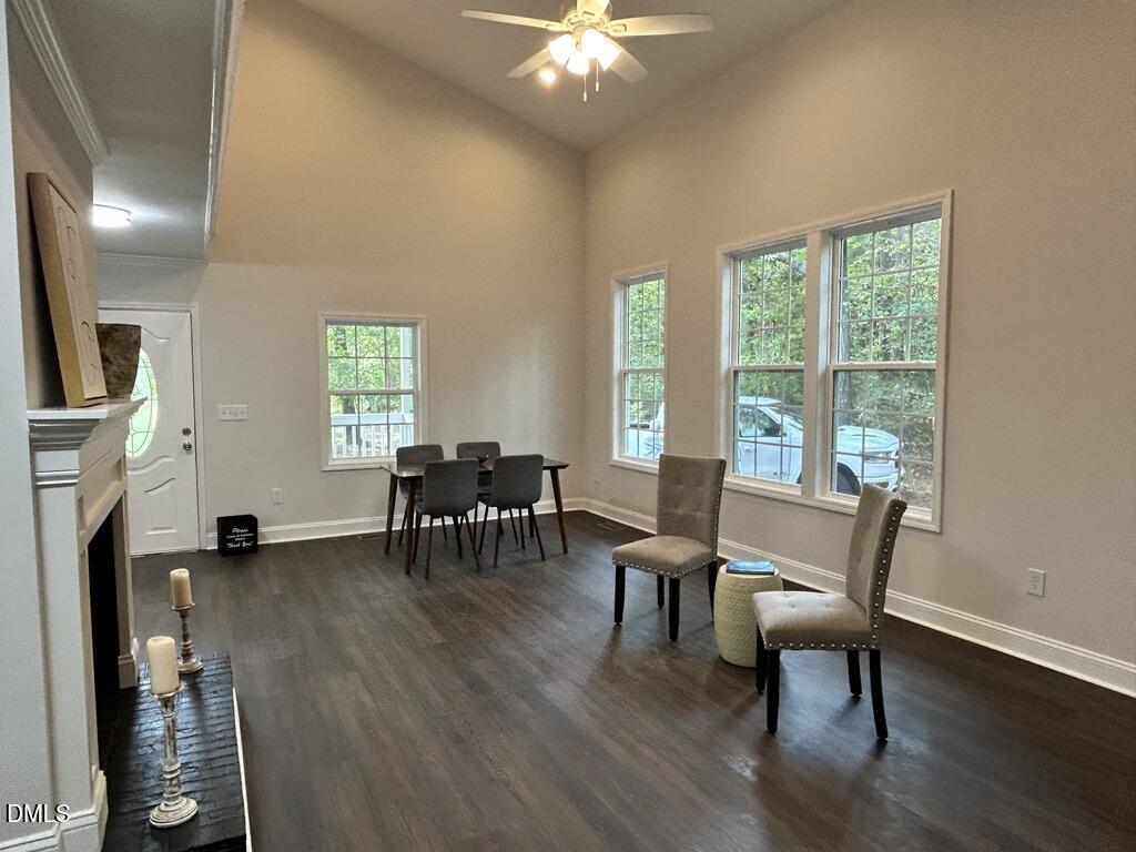 951 Walter Bright Road Sanford, NC 27330 - Photo 6 of 42 a view of a livingroom with furniture a fireplace and wooden floor