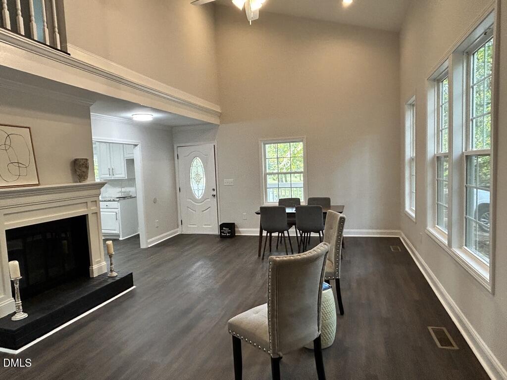 951 Walter Bright Road Sanford, NC 27330 - Photo 7 of 42 a living room with furniture a fireplace and a large window