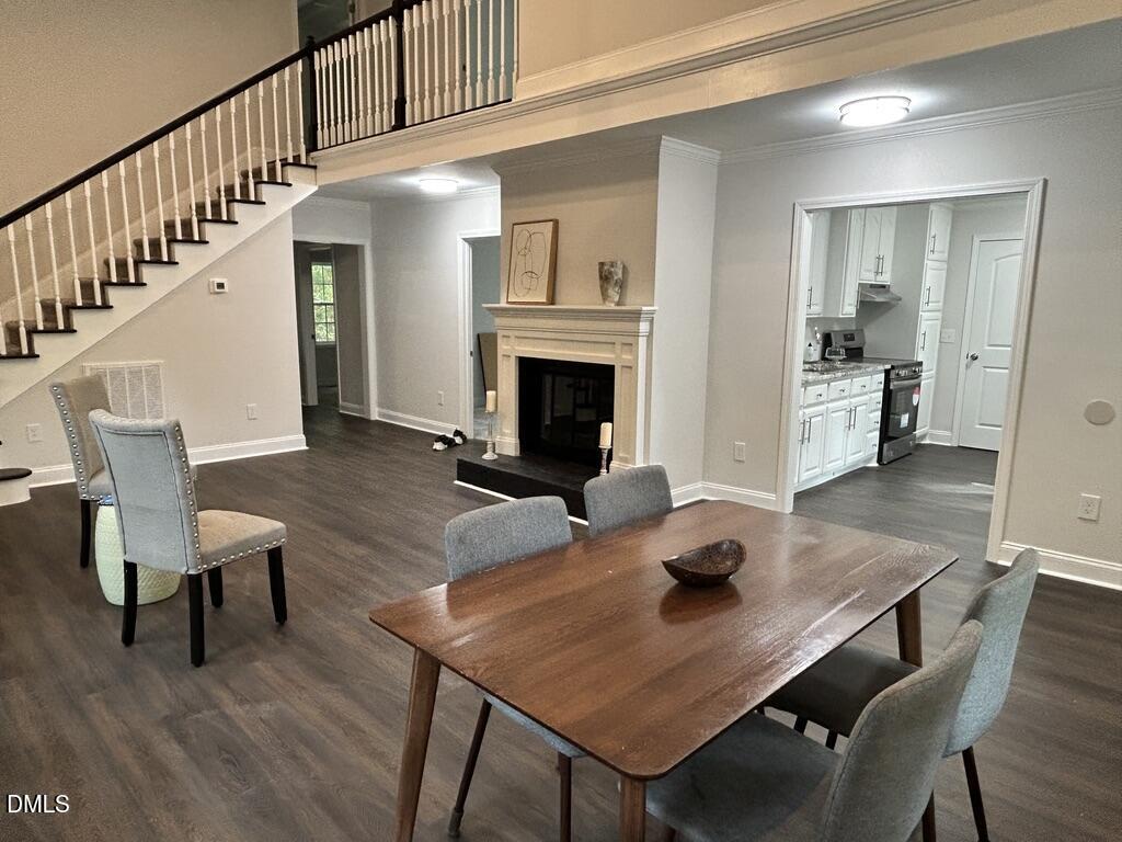 951 Walter Bright Road Sanford, NC 27330 - Photo 8 of 42 a living room with furniture a fireplace and a table