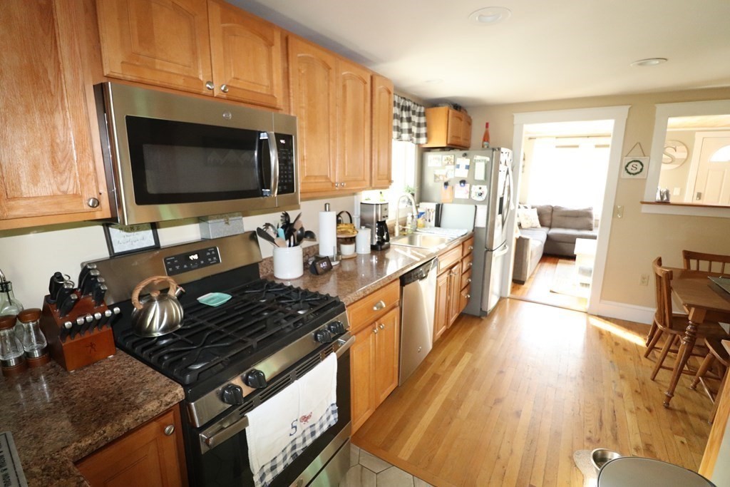 12 Fearing Hill Road Wareham, MA 02571 - Photo 3 of 22 a kitchen with a stove a sink and a microwave