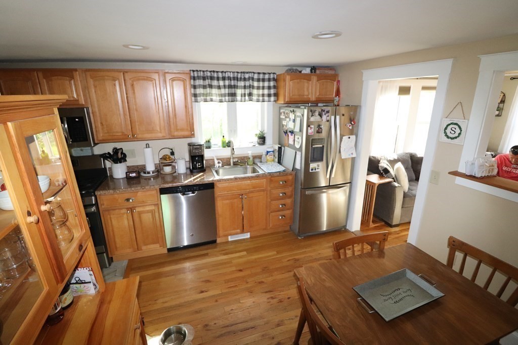 12 Fearing Hill Road Wareham, MA 02571 - Photo 4 of 22 a kitchen with a sink appliances and cabinets