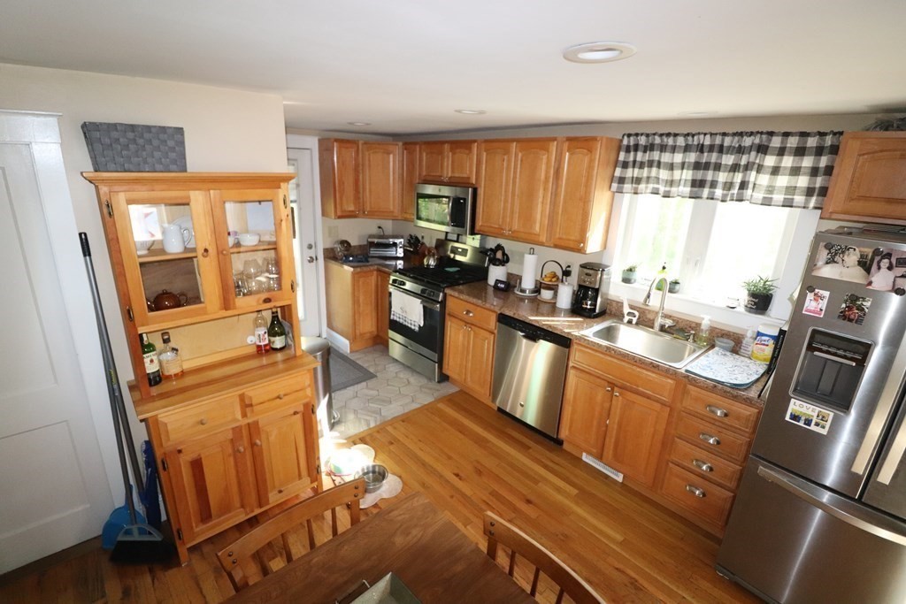 12 Fearing Hill Road Wareham, MA 02571 - Photo 5 of 22 a kitchen with sink refrigerator and window