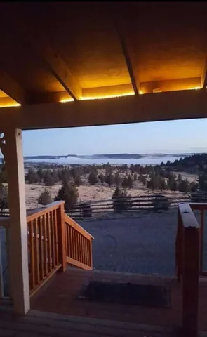 a view of outdoor space with wooden floor