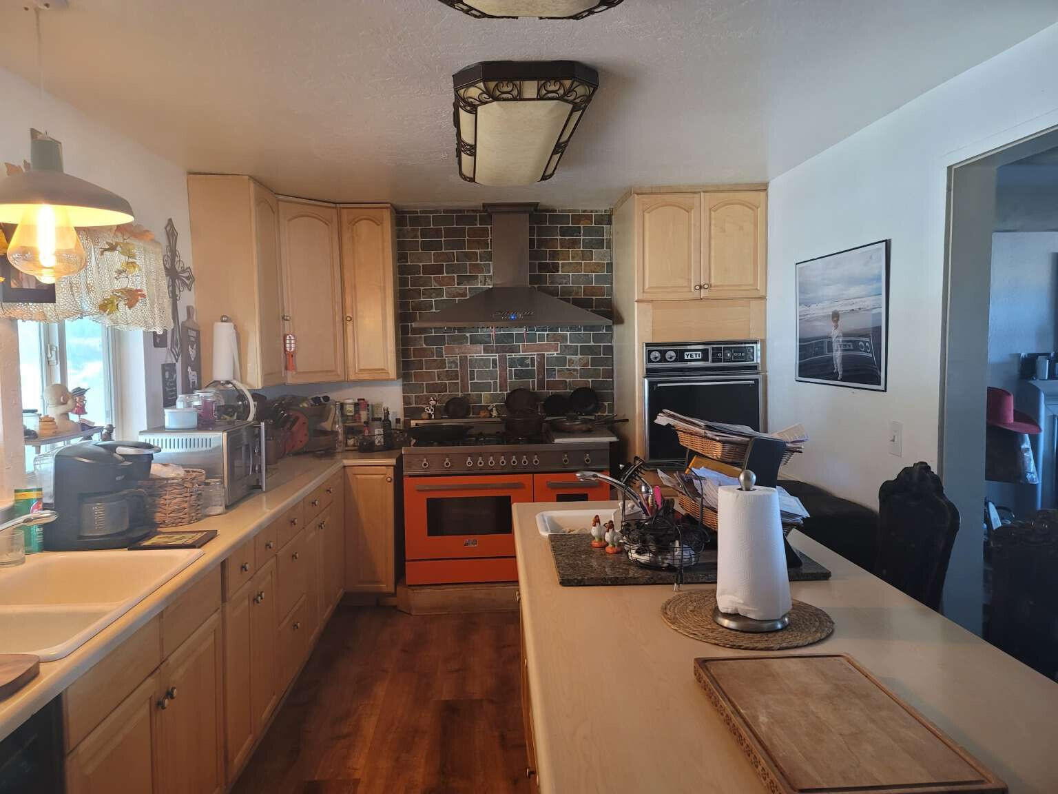 3900 Centerville Road Canby, CA 96015 - Photo 2 of 9 a kitchen with sink refrigerator and window