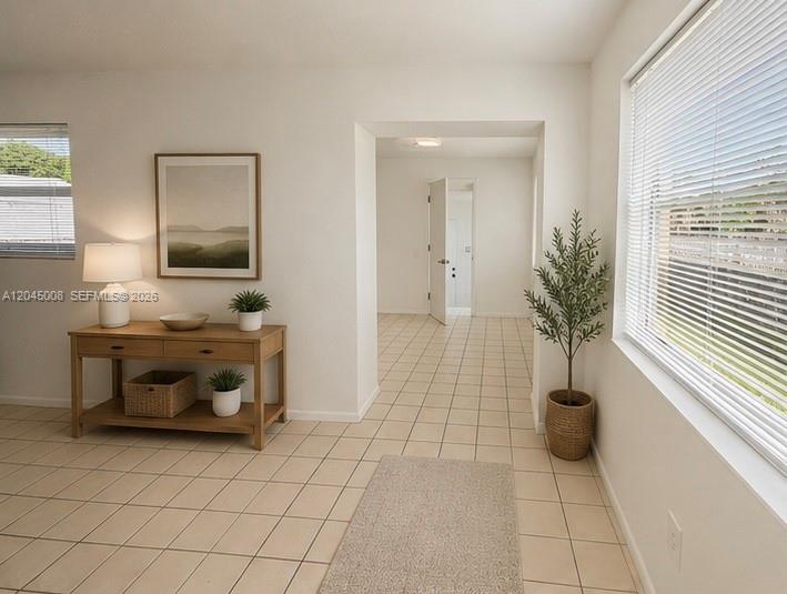 7720 Raleigh Street Hollywood, FL 33024 - Photo 5 of 18 living area entry to kitchen