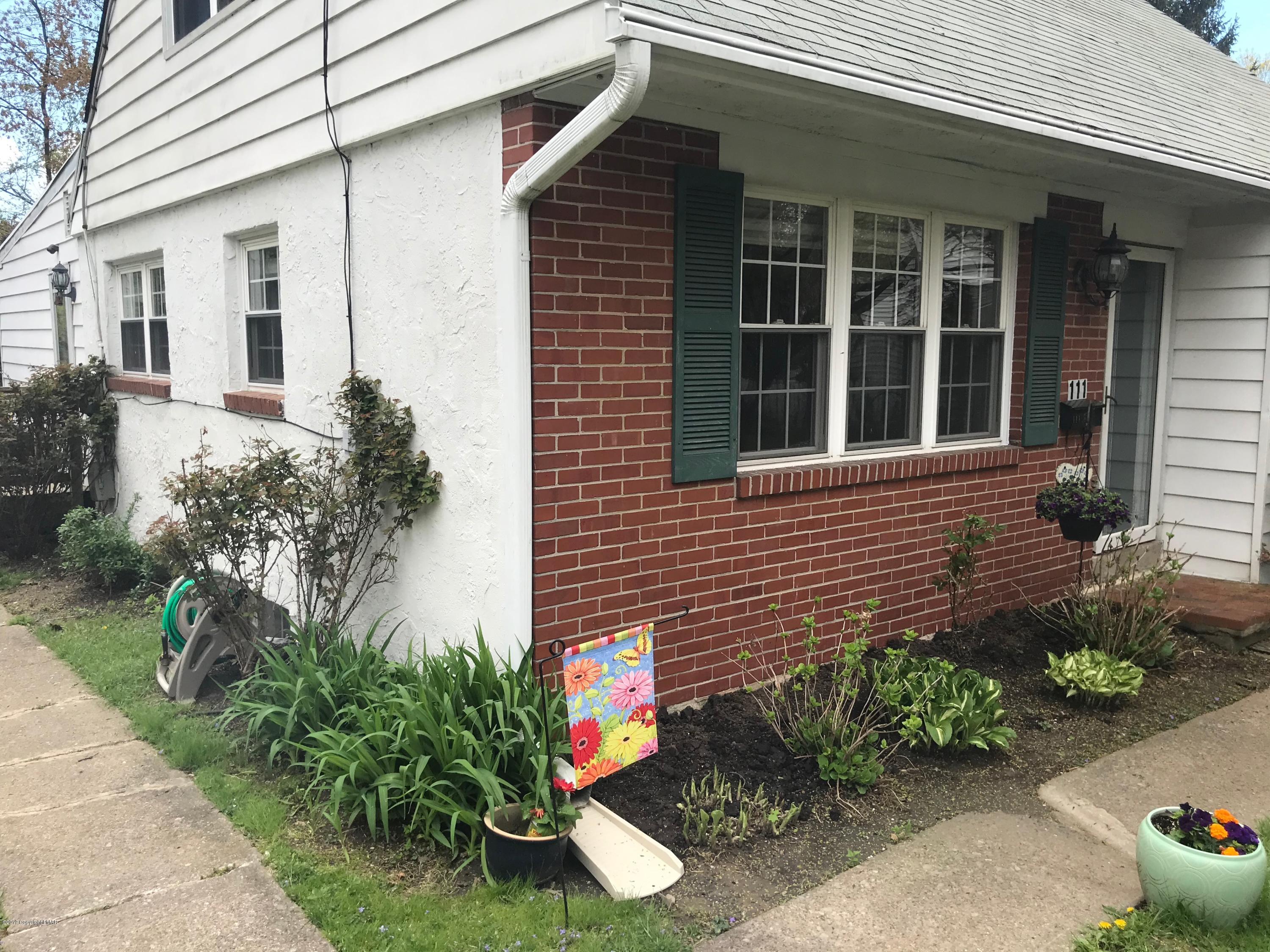 111 Summit Road Media, PA 19063 - Photo 2 of 18 a front view of a house with garden