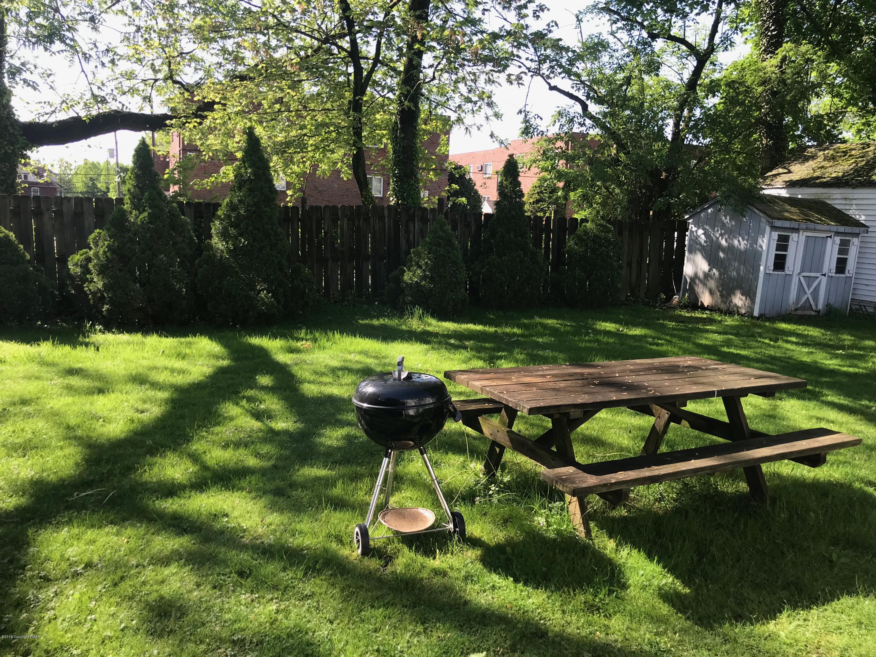 111 Summit Road Media, PA 19063 - Photo 4 of 18 a backyard of a house with table and chairs