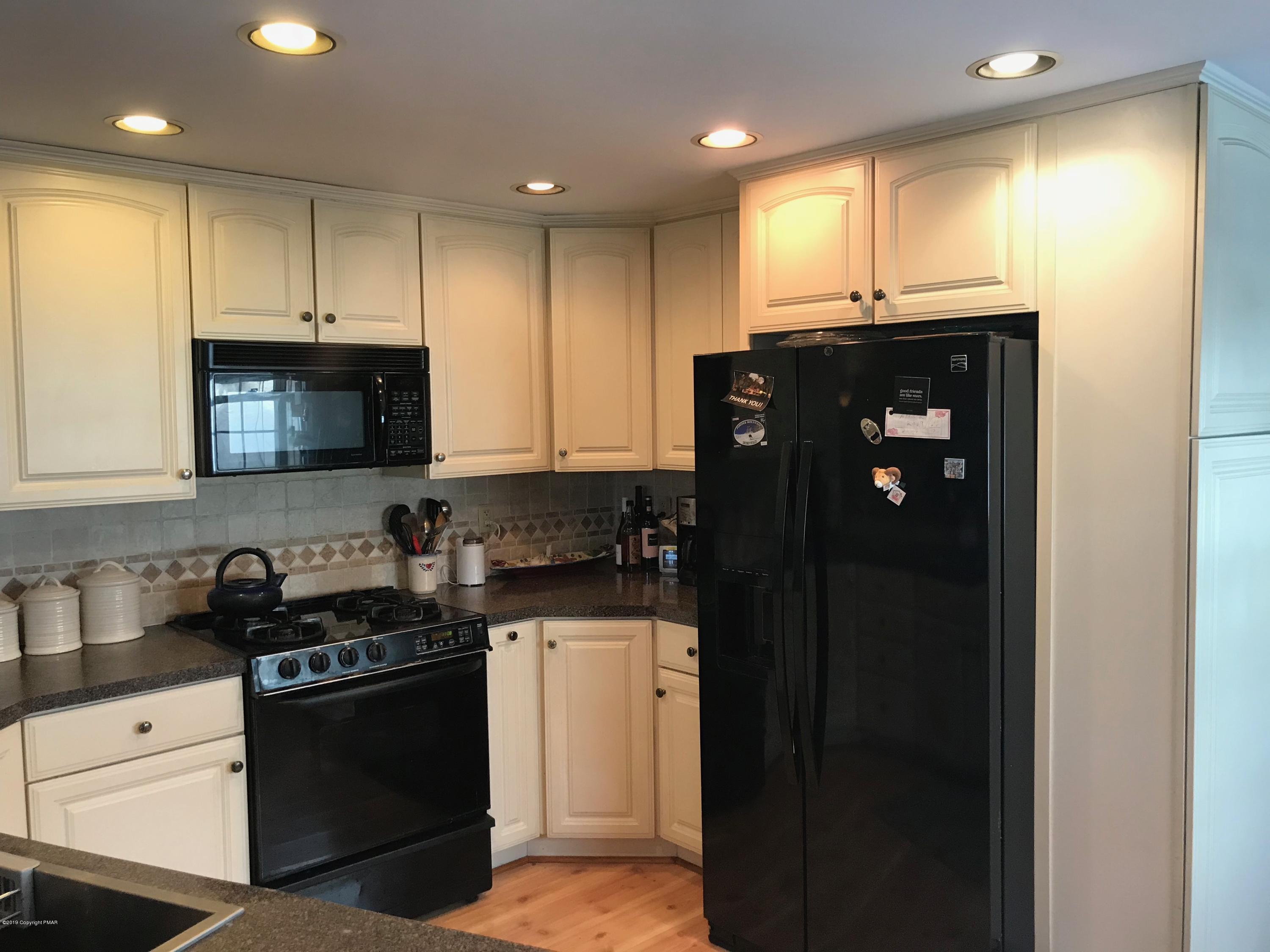 111 Summit Road Media, PA 19063 - Photo 6 of 18 a kitchen with a sink a stove and cabinets