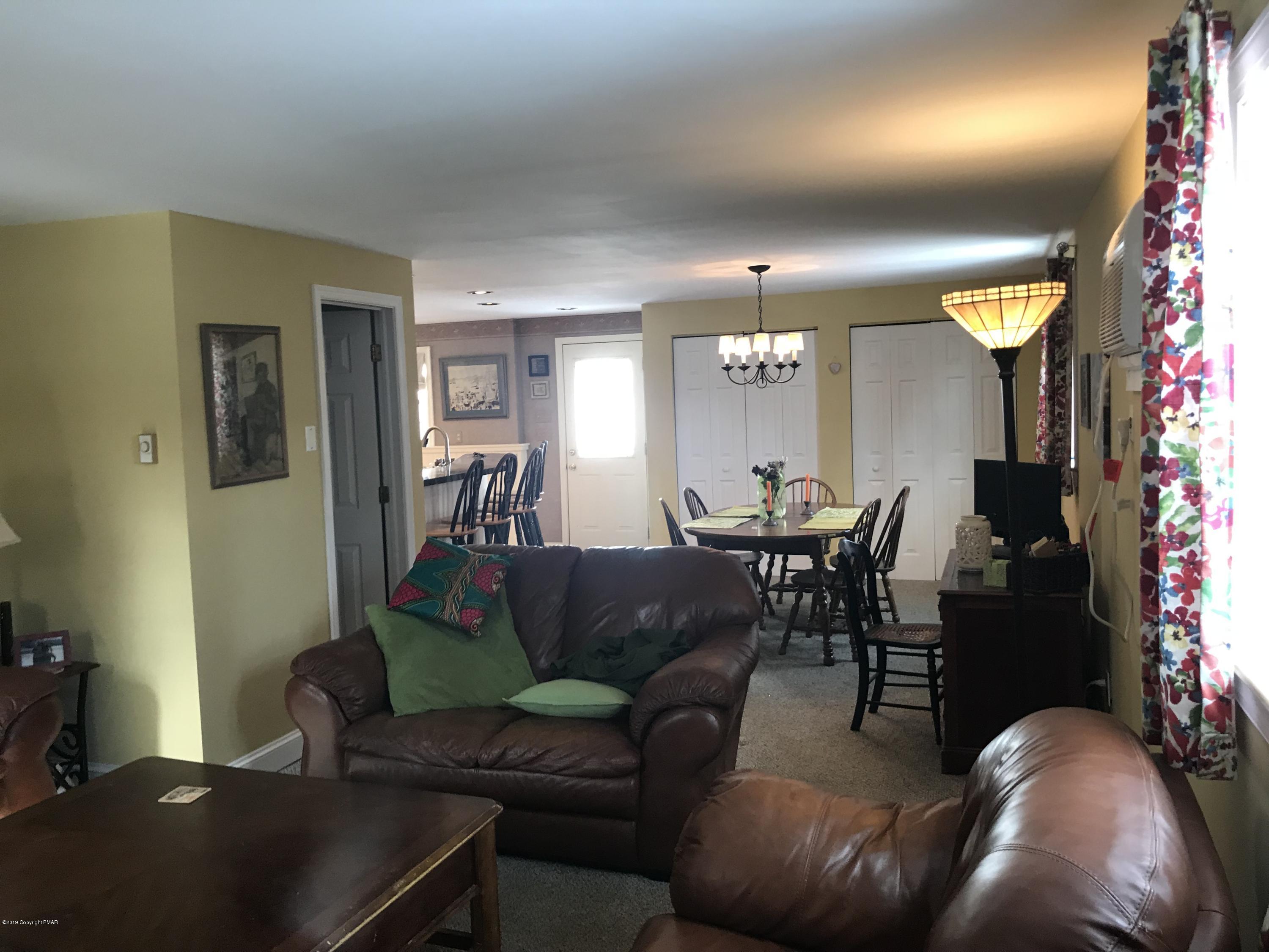 111 Summit Road Media, PA 19063 - Photo 8 of 18 a living room with furniture and a chandelier