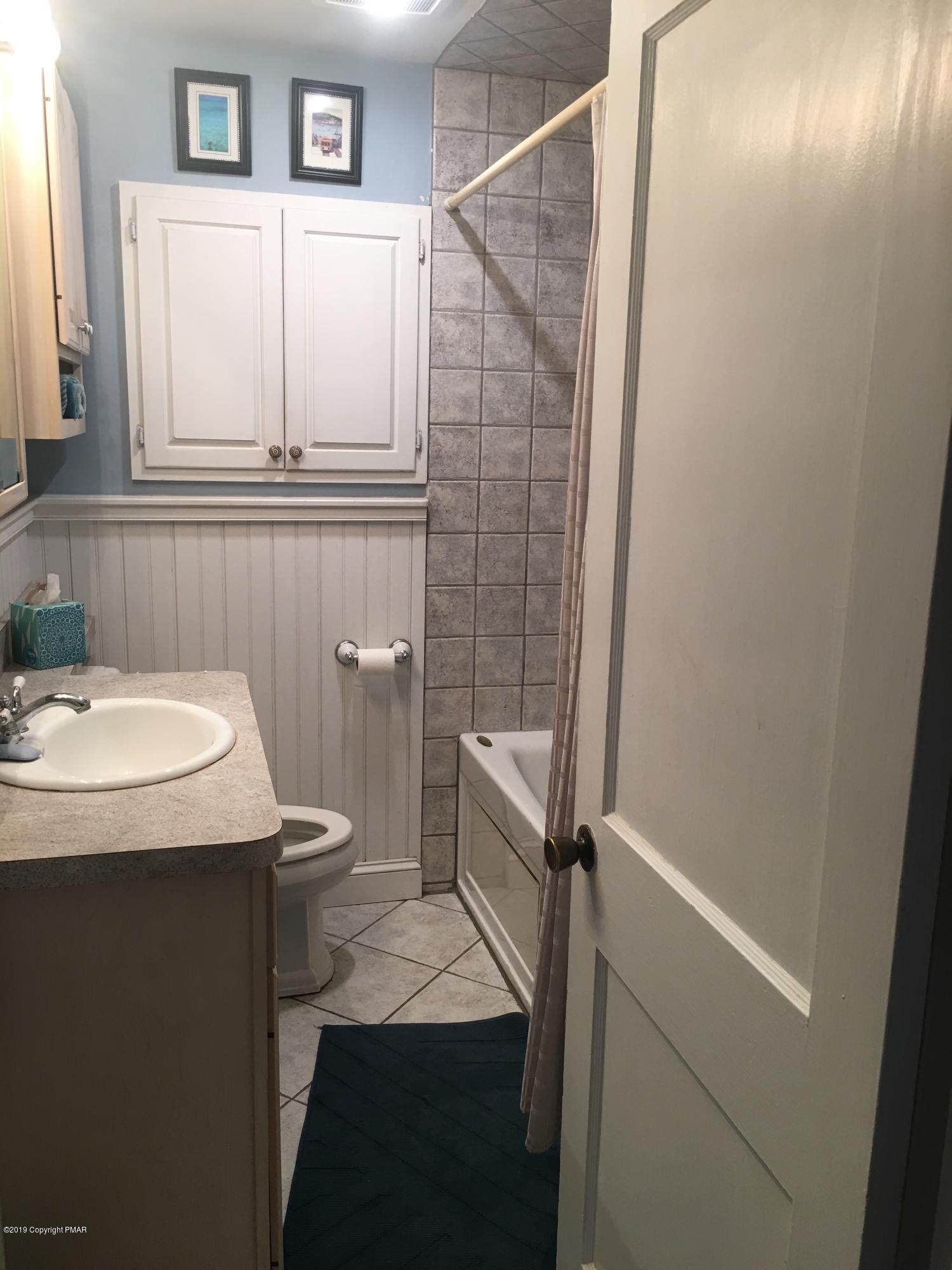 111 Summit Road Media, PA 19063 - Photo 9 of 18 a bathroom with a sink a toilet and shower