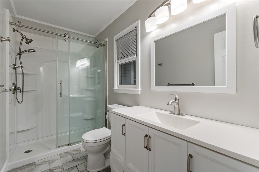 1014 East Queen Street Pendleton, SC 29670 - Photo 26 of 43 A well-appointed bathroom features a spacious shower and a wide vanity with ample counter space.