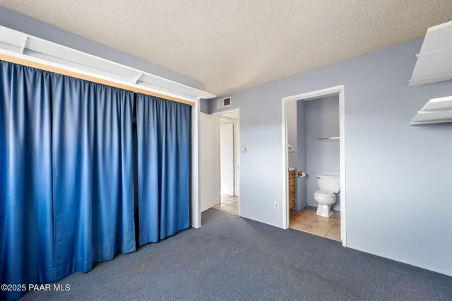 a view of a livingroom and a bathroom