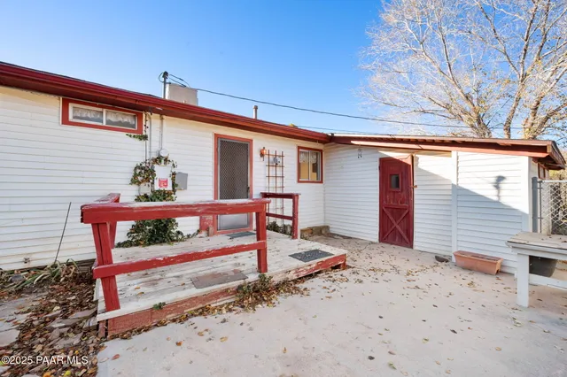 a front view of a house with wooden fence