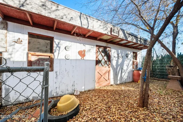 a view of a yard with a house and a car parked