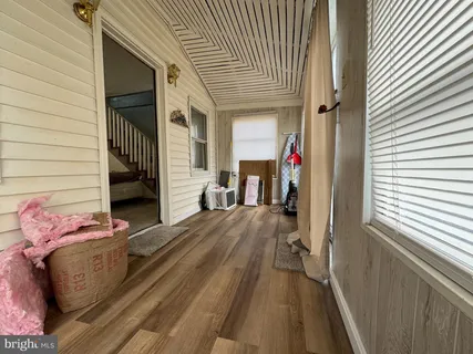a view of a patio with table and chairs