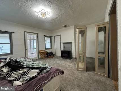 a living room with furniture rug and a window