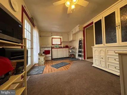 a view of a livingroom with furniture and a flat screen tv