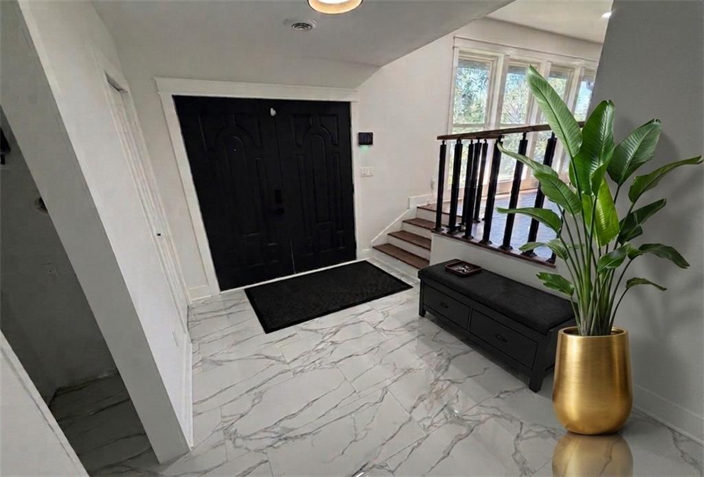 3763 Elkridge Drive Decatur, GA 30032 - Photo 6 of 20 a hallway with a potted plant in front of it