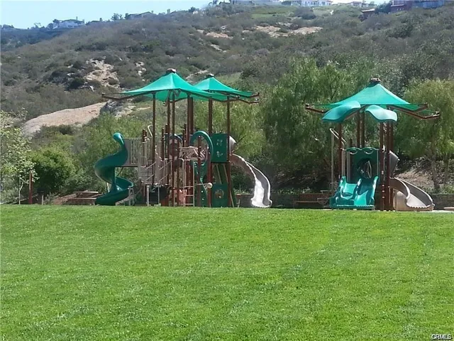 a view of a park with a slide