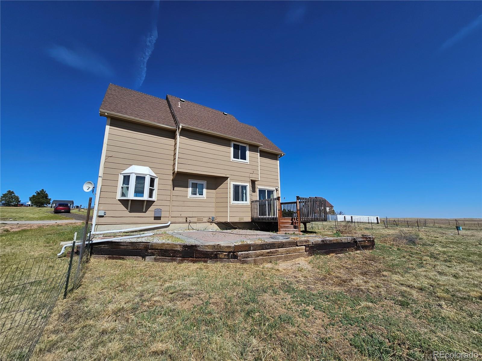 16985 Sage Crest Road Peyton, CO 80831 - Photo 22 of 25 a house view with a outdoor space