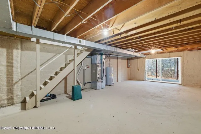 a view of an empty room with stairs