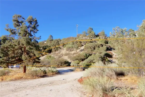 a view of a building with mountains in the background