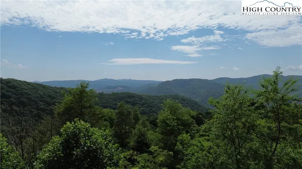 a view of a city with mountains in the background