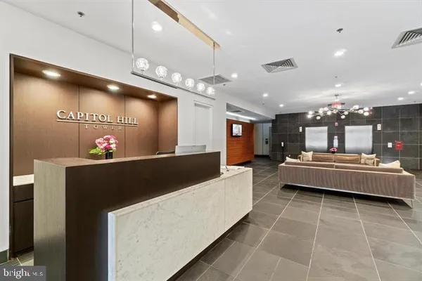 a lobby with a couch and a table