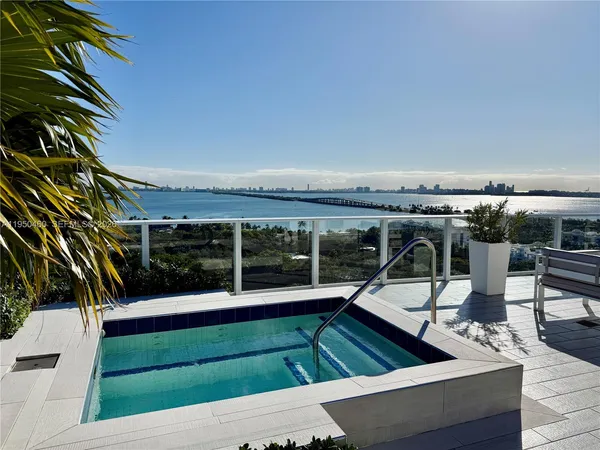 a view of a patio with table and chairs