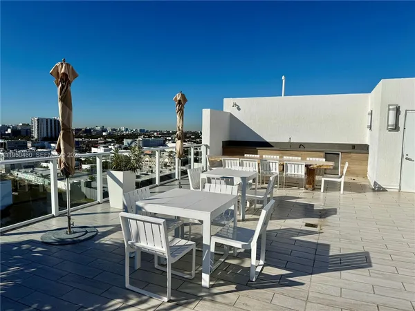 a view of a balcony with chairs