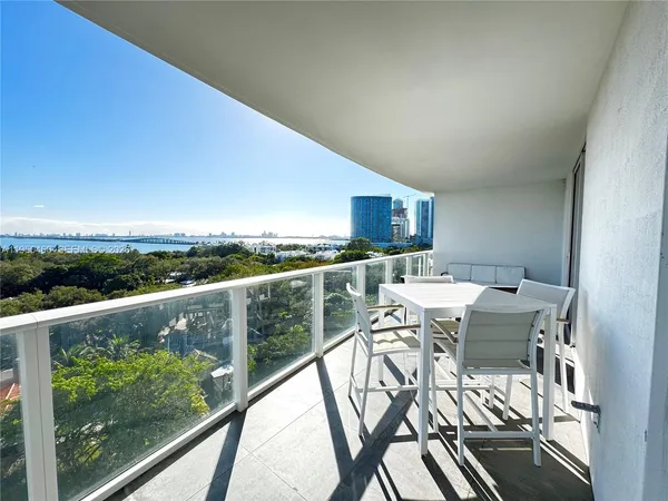 a view of a chairs and table in kitchen