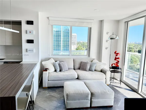 a living room with furniture and a window
