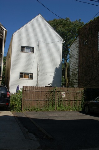 3414 North Seminary Avenue Chicago, IL 60657 - Photo 13 of 14 a front view of a house with a yard