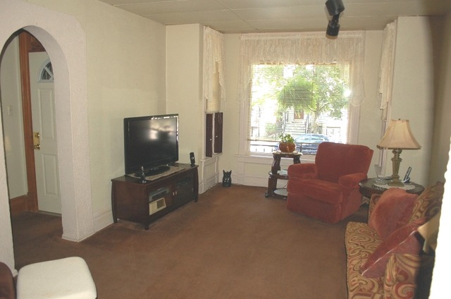 3414 North Seminary Avenue Chicago, IL 60657 - Photo 3 of 14 a living room with furniture and a flat screen tv