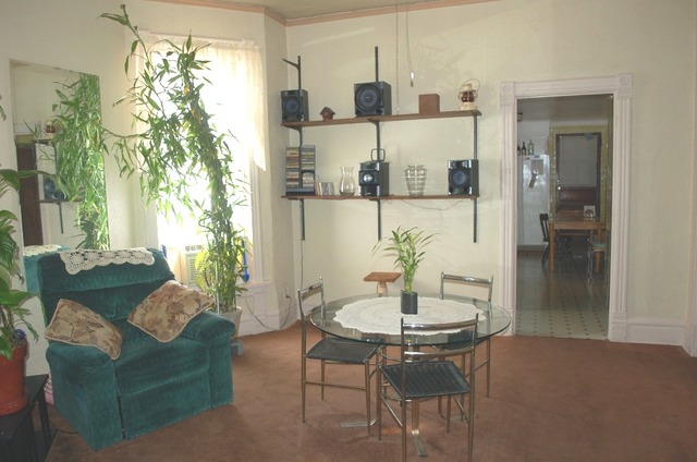 3414 North Seminary Avenue Chicago, IL 60657 - Photo 4 of 14 a living room with furniture and a chandelier